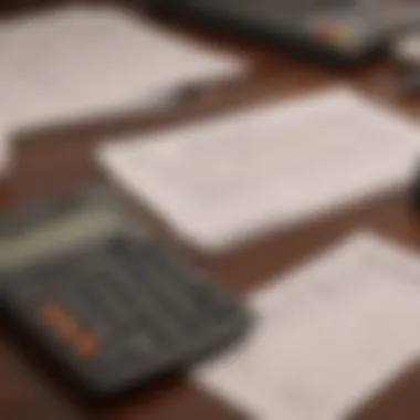 A calculator and budget sheet on a table